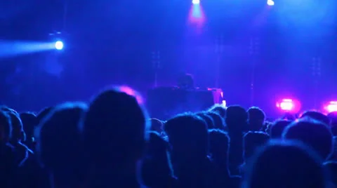 Huge crowd dancing at a DJ show, with great lightning effects. Barcelona Stock Footage 24652650