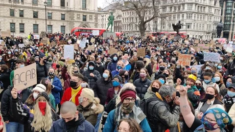 HUGE CROWD GATHERS TO REMEMBER SARAH EVERARD IN PARLIAMENT SQUARE Stock Footage 150338800