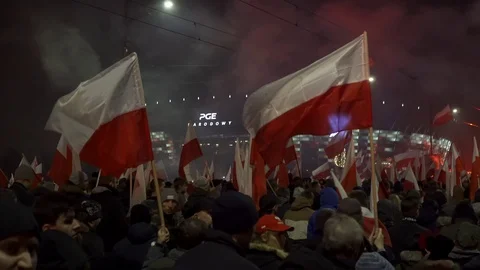 Huge crowd marching at night and holding polish flags during Poland Stock Footage 98305254