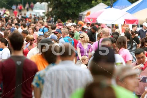 Huge crowd moves through summer festival in atlanta Stock Photos