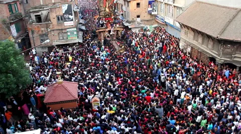 Huge Crowd Pushes the Macchindranāth Stock Footage 49571575