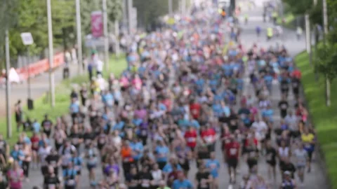 Huge Crowd of Runners in Marathon Race Jogging in Slow Motion Stock Footage 346593115