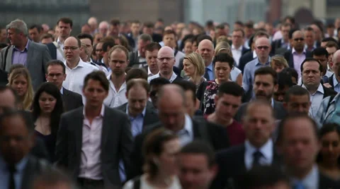 Huge Crowd Of Rush Hour Commuters Flood Down A Busy City Street In Slow Motion Stock Footage