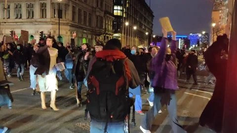HUGE CROWDS OF ANGRY PROTESTERS MARCH TO PARLIAMENT SQUARE FOR SARAH EVERARD Stock Footage 150397737