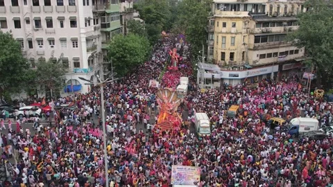 Huge crowds gather for the immersion procession of lord ganesha Stock Footage 219565311