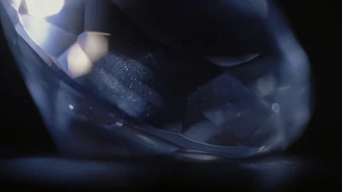 A huge cut diamond is shining and sparkling in the dark. Extra close up. Stock Footage 116630341