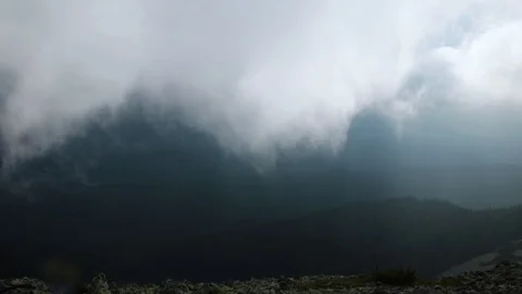 Huge dark thunderstorm cloud with rain in the mountains Stock Footage 119657440