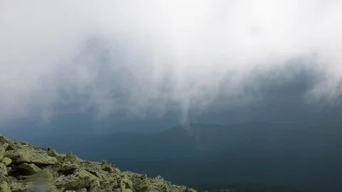Huge dark thunderstorm cloud with rain in the mountains Stock Footage 119657542