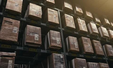 Huge distribution warehouse with boxes on high shelves Stock Photos