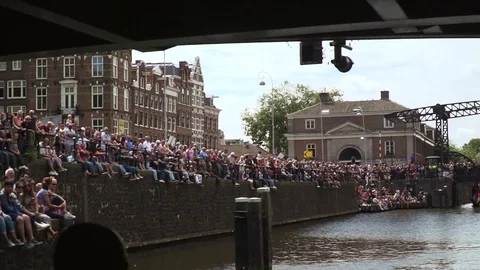 Huge dutch crowd sitting next to water Gay Pride02 Stock Footage 78573316