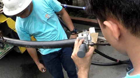 Huge electrical cable splicing and crimping Stock Footage