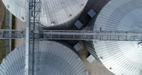 Huge elevator tanks of grain. Metal modern factory tanks. Aerial view. Stock Footage 155492735