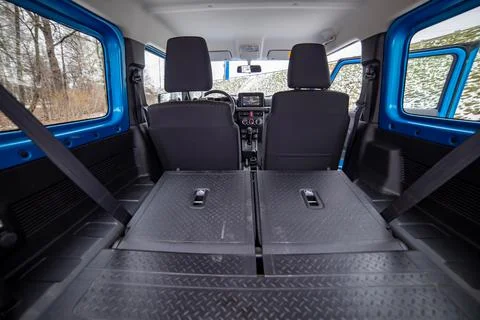 Huge empty car trunk in interior of compact suv. rear seats in offroad suv car Stock Photos