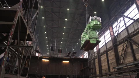 Huge engine hangs on hook near restored fishing ship in dock Vídeos de archivo 158944921