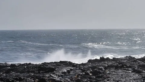 Huge explosive wave breaking on rocky coast Iceland slow motion Stock Footage 78800027