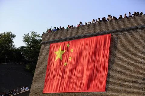 A huge five-star red flag is hanging on the Great Wall, Qinhuangdao City, H.. Stock Photos