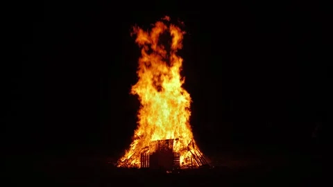Huge flames and charred pallets and doors slow motion 4K Stock Footage 296564952