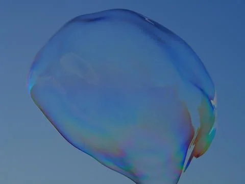 A huge floating bubble beginning to burst... Stock Photos