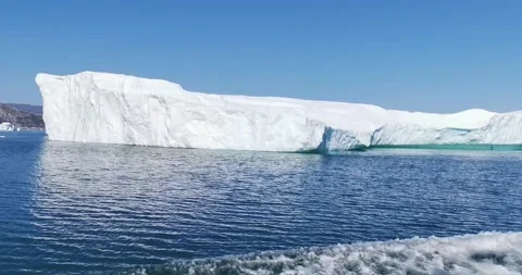 A huge floating glacier by the sea from the deck of a ship Video stock 148198057