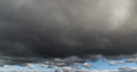 Huge Fluffy Dark Thick Clouds Timelapse 4K Stock Footage 113905399