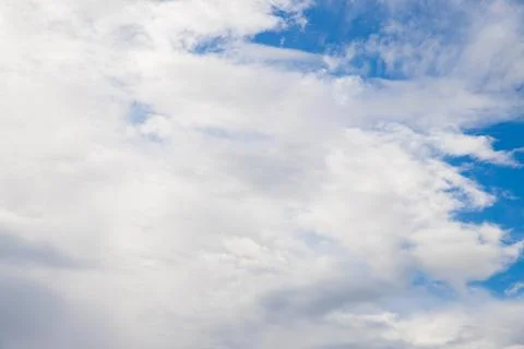 A huge fluffy white cloud in the blue sky Stock Photos