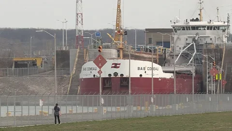 Huge freighter cargo container ship sailing up the Welland canal Stock-Footage 152058779