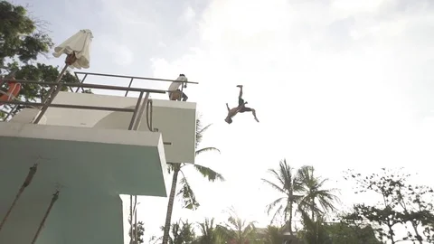 Huge Gainer Off High Dive At Pool Club in Bali Stock Footage 106151505