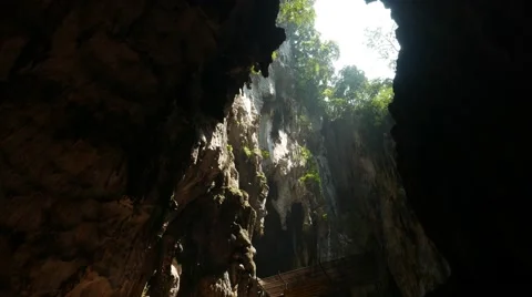 Huge gap in the ceiling of the cave, bri... | Stock Video | Pond5