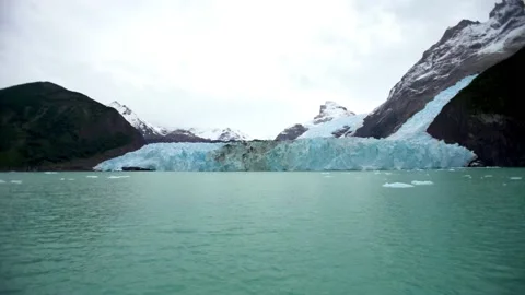 Huge glacier in the middle of mountains Stock Footage 130677929
