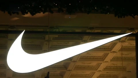 A huge glowing logo of Nike in the window of a company store on Kuznetsky Most Stock Footage 138669415