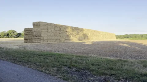 Huge hay bale stack in field 4K Stock Footage 341828104