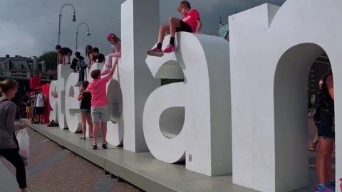 Huge I am Amsterdam letters at Museum Square in Amsterdam in front of National Stock Footage