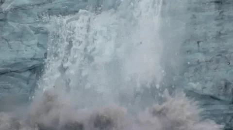 A huge ice fall from the face of glacier into the water at the foot. Video stock 67615976