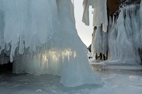 Huge icicles on rocks Stock Photos