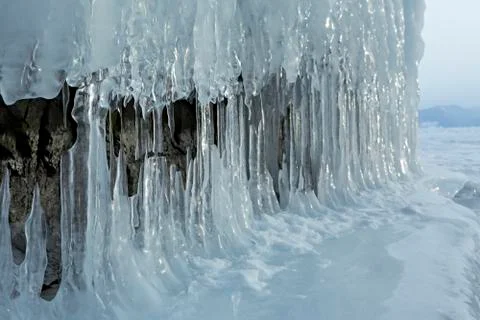 Huge icicles on rocks 스톡 사진