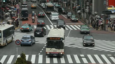 Huge Intersection Shopping Boulevard Tokyo Rainy Day Busy Street Car Passing Bus Stock Footage 12426178