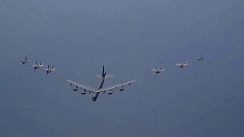 Huge Jet 8 engine B-52 Bomber, accompanied by 6 attack aircraft, epic view Video stock 120368409