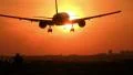 Huge jet crossing sun at sunset HD Footage