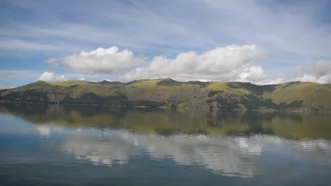 Huge lagoon with distant mountain with forest Stock Footage 273837897
