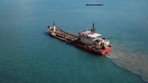 Huge large mega ULCV container ship sails on open water fully loaded Stock Photos