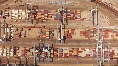 Huge large mega ULCV container ship sails on open water fully loaded Stock Photos
