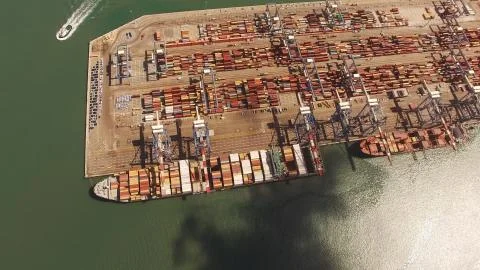 Huge large mega ULCV container ship sails on open water fully loaded 스톡 사진