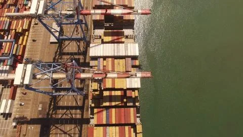 Huge large mega ULCV container ship sails on open water fully loaded Stock Photos