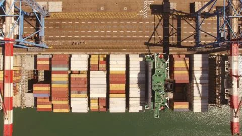 Huge large mega ULCV container ship sails on open water fully loaded Stock Photos