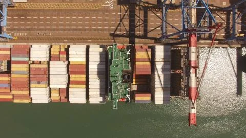 Huge large mega ULCV container ship sails on open water fully loaded Foto stock