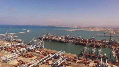 Huge large mega ULCV container ship sails on open water fully loaded Foto stock