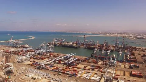 Huge large mega ULCV container ship sails on open water fully loaded Foto stock