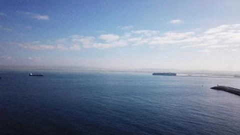 Huge large mega ULCV container ship sails on open water fully loaded Foto stock