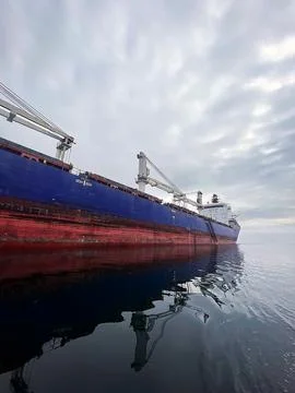 The huge left side of the red and blue ship Photos