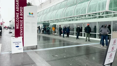 Huge line for COVID-19 booster shots at Vancouver Convention Centre Stock Footage 168255152
